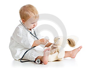 Child dressed as doctor playing with toy
