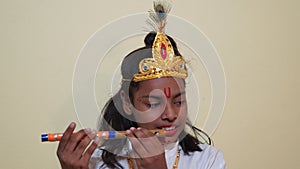 Child dressed as Lord Sri Krishna on the Janmashtami festival or Ashtamirohini day for the procession