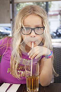 Child with drink and straw