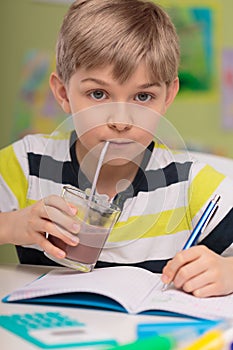 Child drinking caloric cocoa