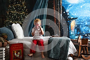 Child drinking cocoa at Christmas