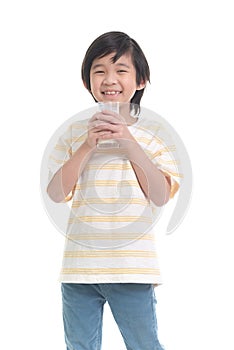 Child drinking milk from a glass on white background isolated