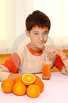 Child drinking orange juice