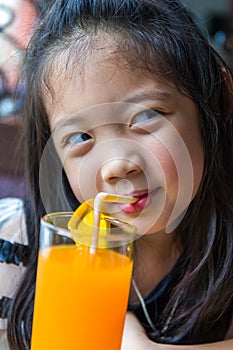 Child Drinking Orange Juice