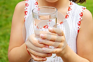 Child drinking pure water in nature.selectiv fokus