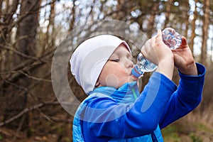 Child drinking water from a bottle