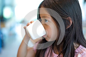 Child Drinking Water from Cup