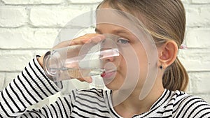 Child Drinking Water, Kid Drinks Fresh Water from Glass, Thirsty Blonde Girl in Kitchen, Children Healthcare