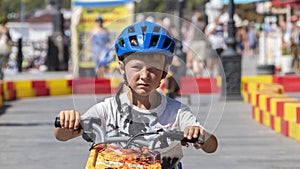 Child drives an electric car. Go-karts for children