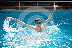 Child drowning in to the water and show up hands for help