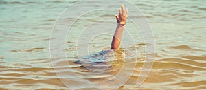 A child drowns in water at sea. Selective focus