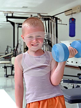 Child with dumbbell