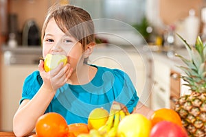 Child eating an apple photo