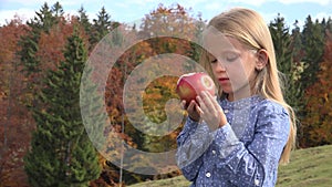 Child Eating Apples in Camping in Mountains, Kid Eats Fruits on Meadow, Hungry Girl at Picnic Outdoor in Nature, Alpine View