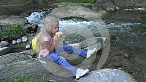 Child Eating Apples by River, Kid in Camping, Mountains View, Girl Eats Fruits