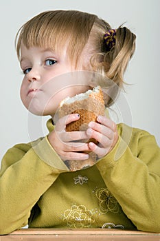 Child eating bread photo