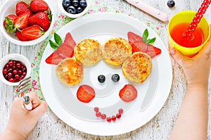 Child eating breakfast concept. Fun food for kids. Picture from