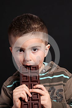 Child eating a chocolate bar
