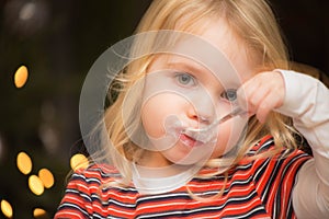 Child eating a dessert, pudding with a spoon