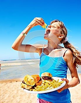 Child eating fast food.