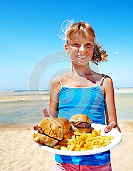 Child eating fast food.
