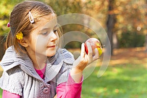 Child eating fresh apple photo