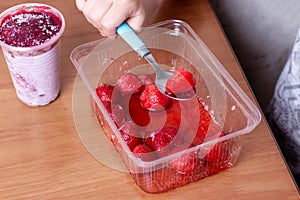 Child eating frozen strawberries