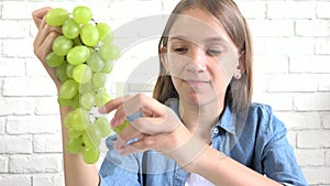 Child Eating Grapes at Breakfast, Kid Eats Fruits in Kitchen, Hungry Girl Eat Healthy Food for Diet, Children Healthcare Nutrition