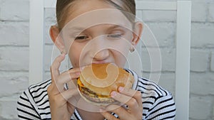 Child Eating Hamburger in Restaurant, Kid Eats Junk Fast Food Hungry Little Girl