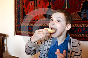 Child eating khachapuri
