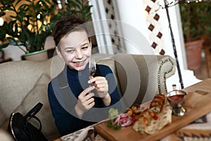 Child eating lula kebab