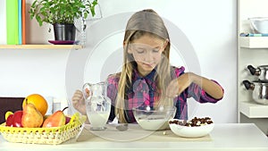 Child Eating Milk with Cereals, Kid in Kitchen Young Girl Eats Healthy Breakfast