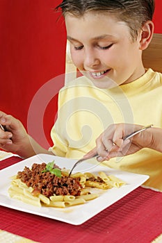 Child eating pasta