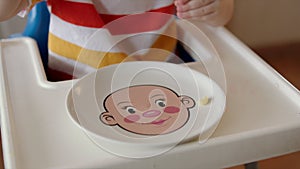 Child Eating Pasta from Funny Plate