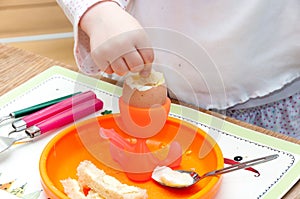 Child eating soft boiled egg