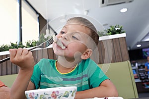 Child eating vareniki