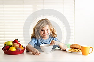 Child eats organic food. Healthy vegetables with vitamins. Proper kids nutrition concept.