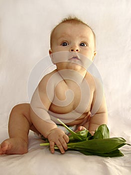 The child eats porridge photo