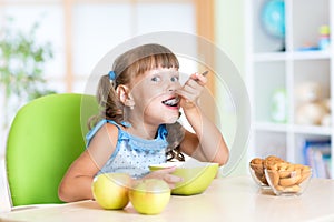 Child eats tasty breakfast