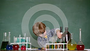 Child from elementary school. schoolboy. Little kids scientist earning chemistry in school lab. Biology experiments with