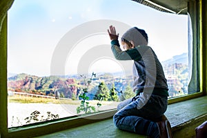 Child enjoying a mountain autumn landscape