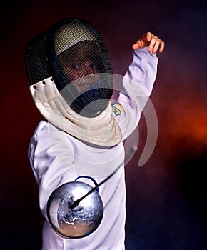 Child epee fencing lunge.