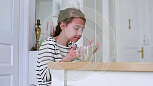 A child with an excellent appetite was very pleased with spaghetti and licks the plate.