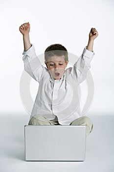 Child excited with laptop computer