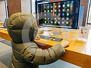 Child Exploring Apple Store Display