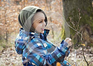 Child exploring spring nature in forest