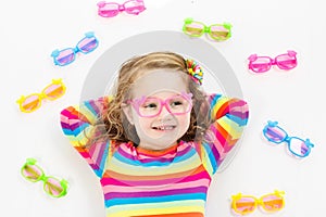 Child at eye sight test. Kid at optitian. Eyewear for kids.