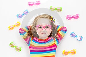 Child at eye sight test. Kid at optitian. Eyewear for kids.