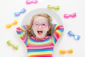 Child at eye sight test. Kid at optitian. Eyewear for kids.