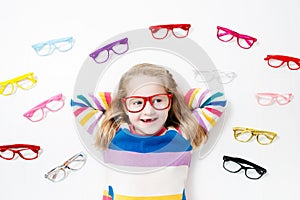 Child at eye sight test. Kid at optitian. Eyewear for kids.